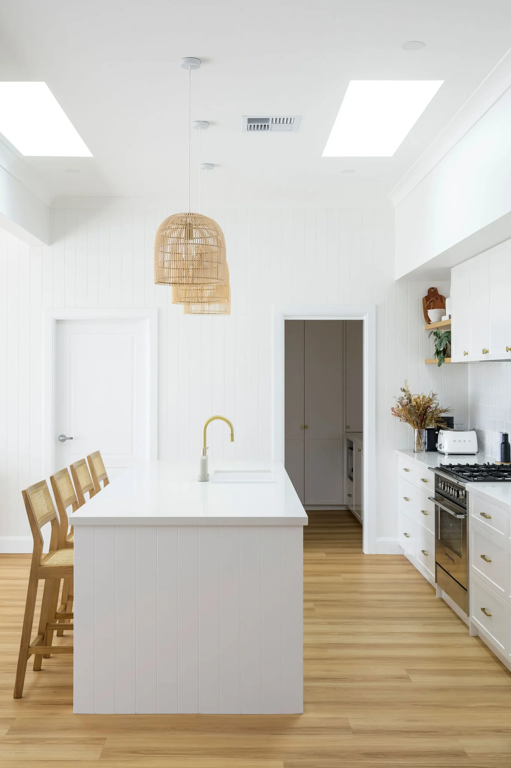 Maitland kitchen with cladded walls and skylights